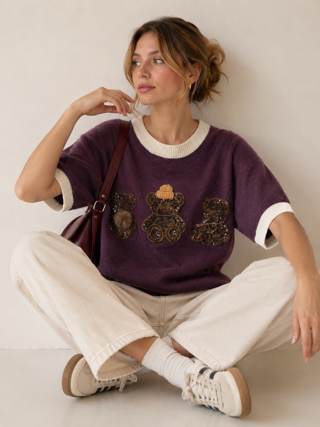 Pullover mit Schleife und Pailletten